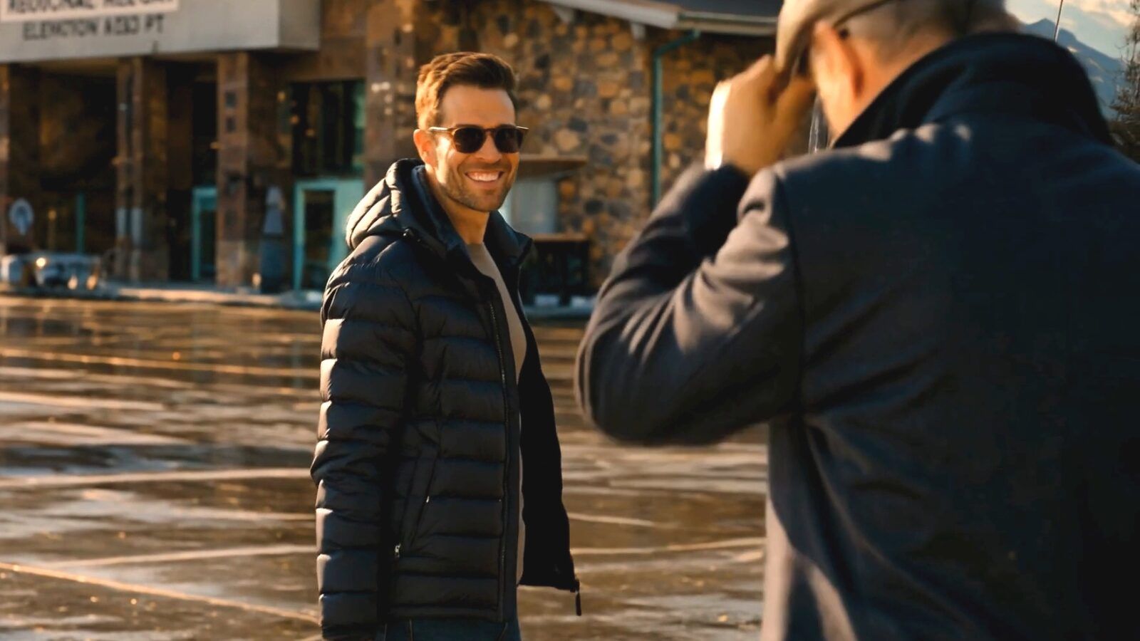 The Concierge-Driver tips his cap to a smiling arriving guest — the first warm welcome